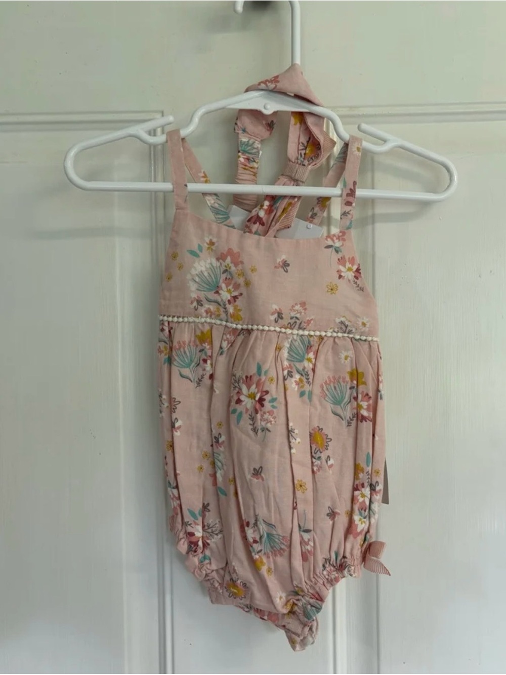 NWT 3/6M Dylan & Abby pale pink/teal/yellow floral criss-cross back bubble/bow